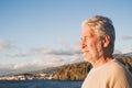 Close up and portrait of sad and pensive man looking at the sea in the beach - upset people lifestyle concept Royalty Free Stock Photo