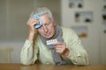 Portrait of sad sick senior man with pills Royalty Free Stock Photo