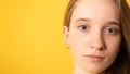 Close-up portrait of sad teenager girl with beautiful gray eyes. Pensive young  woman with gray-blue eyes Royalty Free Stock Photo