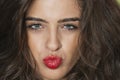 Close-up portrait of a seductive young female puckering lips Royalty Free Stock Photo