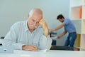 Close-up portrait senior businessman sitting at office Royalty Free Stock Photo