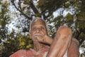 Close-up portrait of Senior citizen Indian man sitting on a chair in the evening sad thinking something Royalty Free Stock Photo