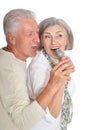 Close up portrait of senior couple with microphone Royalty Free Stock Photo