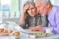 Portrait of senior couple using laptop at home Royalty Free Stock Photo