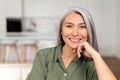 Close-up portrait on senior gray-haired woman in home interior Royalty Free Stock Photo