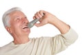 Close up portrait of senior man singing into microphone Royalty Free Stock Photo