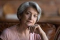 Portrait of mature Caucasian grandmother thinking at home Royalty Free Stock Photo