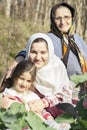 Close-up portrait of Senor Grandmother with her grandchilds at cabbage garden