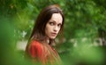 Close up portrait of sensitive woman in the park