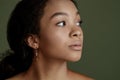 Close up portrait of sensual young female. Clean skin. Healthy care. Portrait of beautiful african american in hat Royalty Free Stock Photo