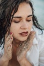 Close up portrait of sensual young woman with sand Royalty Free Stock Photo