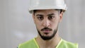 Close-up portrait of serious arabian man male foreman professional inspector builder mechanic engineer wear uniform