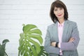 Close up portrait of a serious business woman in gray suit standing in the city Royalty Free Stock Photo