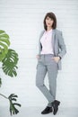 Close up portrait of a serious business woman in gray suit standing in the city Royalty Free Stock Photo