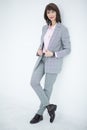 Close up portrait of a serious business woman in gray suit standing in the city Royalty Free Stock Photo
