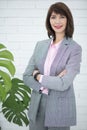 Close up portrait of a serious business woman in gray suit standing in the city Royalty Free Stock Photo