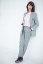 Close up portrait of a serious business woman in gray suit standing in the city Royalty Free Stock Photo