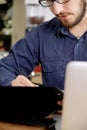 Man writing on clipboard, close up Royalty Free Stock Photo