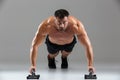 Close up portrait of a serious strong shirtless male bodybuilder