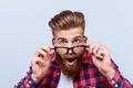 Close up portrait of shocked amazed man in checkered shirt touch Royalty Free Stock Photo