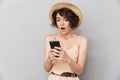 Close up portrait of a shocked woman in summer hat Royalty Free Stock Photo