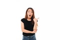 Close-up portrait of shocked young pretty asian woman showing th Royalty Free Stock Photo