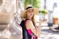 Attractive young woman talking with somebody on her mobile phone while standing on the street Royalty Free Stock Photo