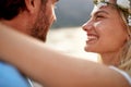 Close up portrait shot of joyful bride with big smile looking at her husband. Couple by seaside. Wedding, travel, honeymoon, love Royalty Free Stock Photo