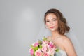 Asian bride standing and holding a bouquet Royalty Free Stock Photo