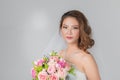 Asian bride standing and holding a bouquet Royalty Free Stock Photo