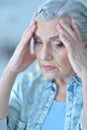 Close-up portrait of sick beautiful senior woman with headache Royalty Free Stock Photo