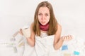 Close up portrait of sick woman with grippe holding cup of hot tea