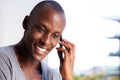 Close up smiling african american man talking on mobile phone Royalty Free Stock Photo