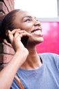 Close up smiling african american woman talking on mobile phone Royalty Free Stock Photo