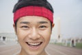 Close up portrait of smiling athlete wearing a headband