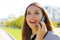 Close up portrait of smiling business woman having a conversation on her cell phone outdoors Royalty Free Stock Photo