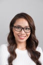 Close-up portrait of smiling confident businesswoman looking straight, isolated on grey background. Royalty Free Stock Photo