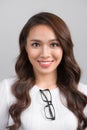 Close up portrait of smiling confident businesswoman looking straight, isolated on grey background. Royalty Free Stock Photo