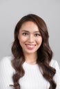 Close up portrait of smiling confident businesswoman looking straight, isolated on grey background. Royalty Free Stock Photo