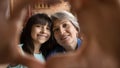 Portrait of happy Hispanic grandmother and little granddaughter Royalty Free Stock Photo