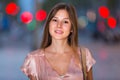 close-up portrait of smiling slim adult girl in sexy evening apparel