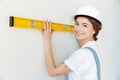 Close up portrait of a smiling woman builder in hardhat