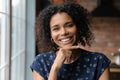 Portrait of smiling biracial woman posing in own home Royalty Free Stock Photo