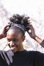 African girl on background of blossom tree outdoor Royalty Free Stock Photo