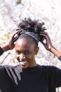 African girl on background of blossom tree outdoor Royalty Free Stock Photo