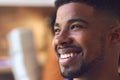 Close Up Portrait Of Smiling Young Businessman At Desk In Modern Office Royalty Free Stock Photo