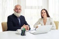 Close up of portrait of smiling young businesswoman and senior i Royalty Free Stock Photo