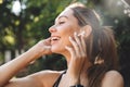 Close up portrait of a smiling young fitness girl listening Royalty Free Stock Photo