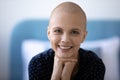 Portrait of smiling hairless woman cancer fighter