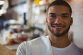 Close-up of portrait of waiter in cafe